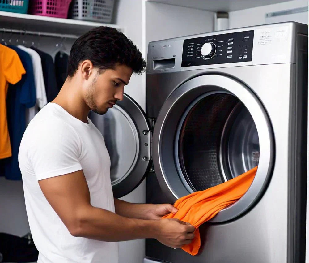 a man washing his football shirt